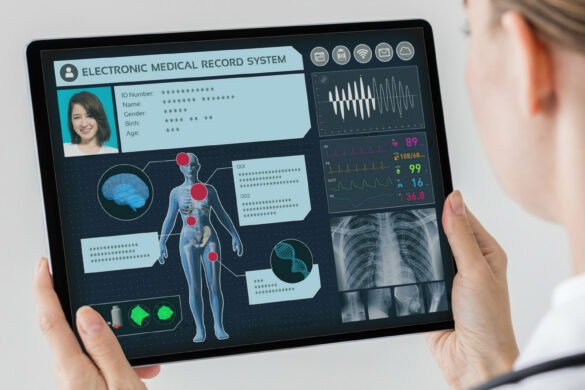 A doctor views patient records on a digital screen.